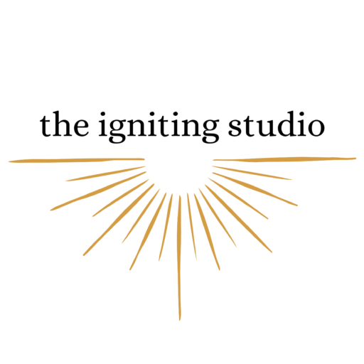 The Igniting Studio logo with golden rays design.